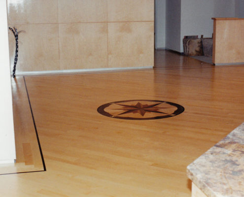 Maple Flooring with Wenge feature strip and Compass Medallion